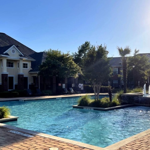 a swimming pool in front of a building