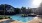 a swimming pool in front of a building